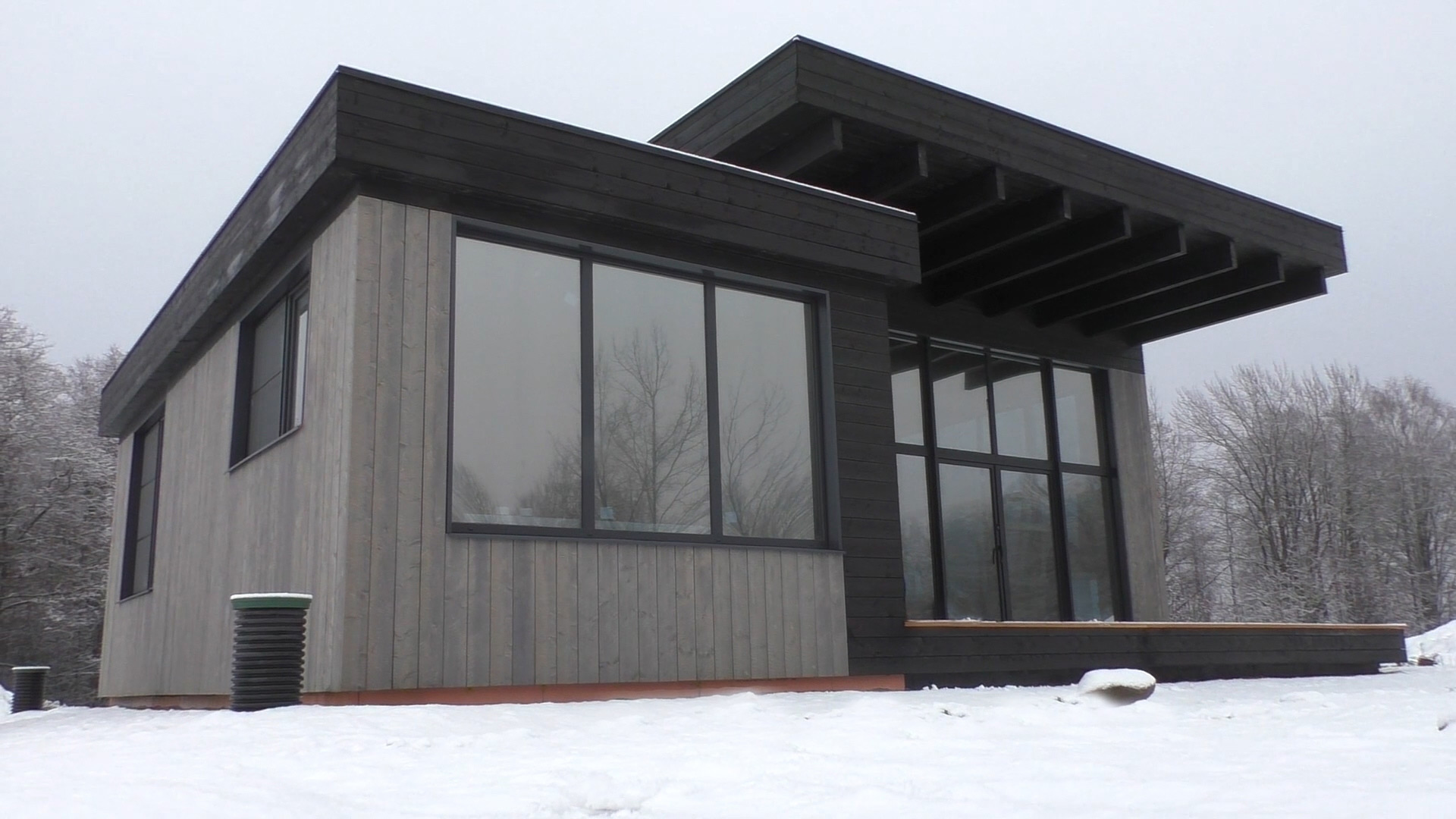 Modern prefabricated timber house in winter